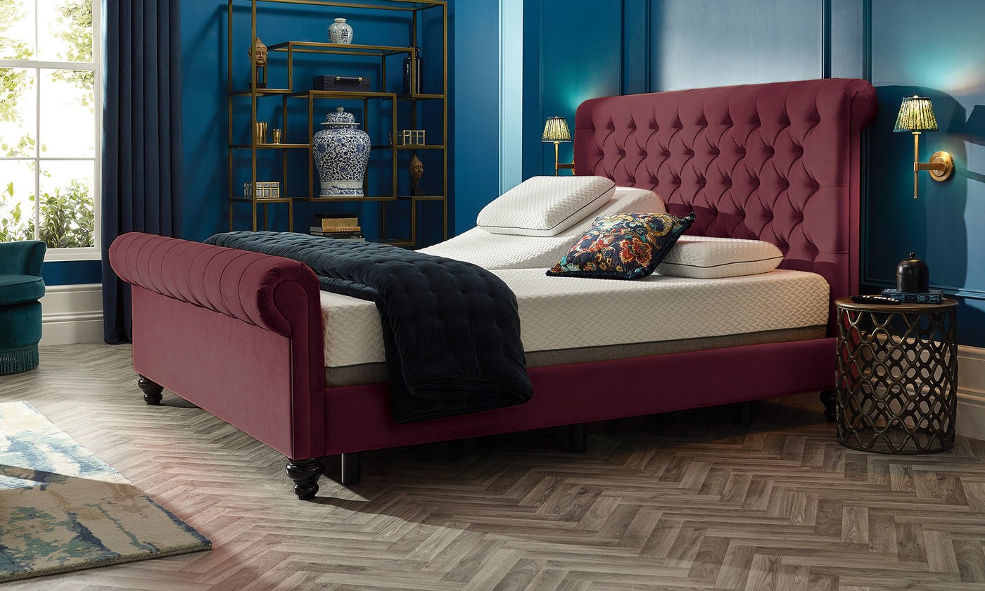 Adjustable bed with the backrest and leg rest raised on one side