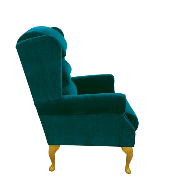 The Windsor in teal, side view showing the winged back and scroll arm
